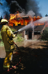 Fireman fighting residential fire
